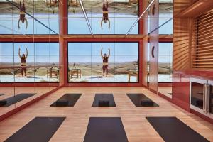 a yoga room with a view of the desert at The Emory, Maybourne in London