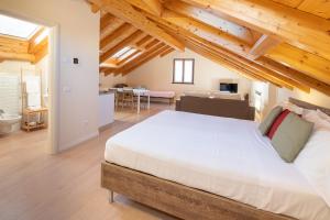 Cama ou camas em um quarto em Il Grifo