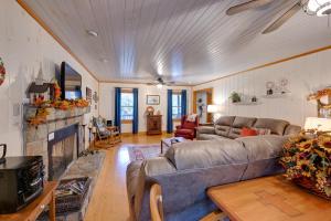 a living room with a couch and a fireplace at Creekside Family Retreat by Waterfalls and Hiking! in Sapphire