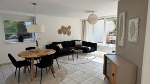 a living room with a couch and a table at Im Herzen Halterns in Haltern