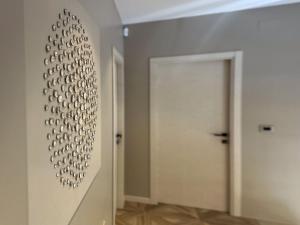 a hallway with a wall of knobs on the wall at Villa Villa Perla di Draga by Interhome in Mošćenička Draga