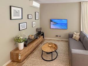 a living room with a couch and a table at Villa Villa Perla di Draga by Interhome in Mošćenička Draga