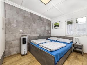 a bedroom with a large bed in a room at Holiday Home Mediana by Interhome in Balatonmáriafürdő