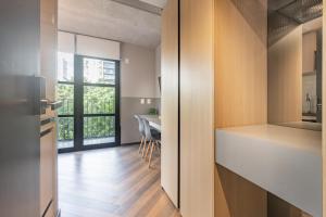 a kitchen and dining room with a table and chairs at Housi Faria Lima in Sao Paulo +270 photos