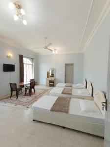 A bed or beds in a room at Leyla Hostel