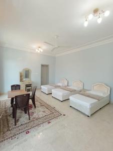 A bed or beds in a room at Leyla Hostel