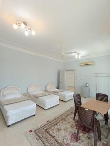 A bed or beds in a room at Leyla Hostel