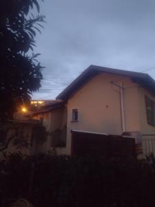 a house with a light on the side of it at Loft 43 in La Trinité