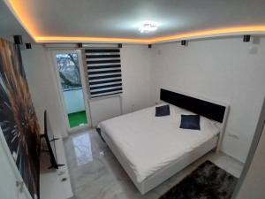 Postel nebo postele na pokoji v ubytování Apartman Tiha Noc