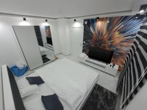 Postel nebo postele na pokoji v ubytování Apartman Tiha Noc