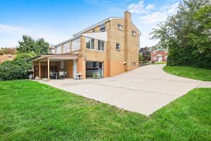 a large brick building with a large driveway at Modern and Spacious House Pittsburgh in Pittsburgh