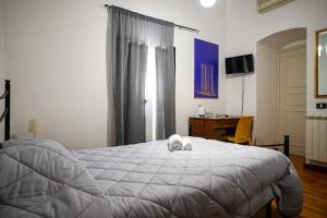 Postel nebo postele na pokoji v ubytování B&B Al Centro