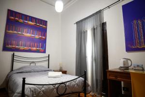Postel nebo postele na pokoji v ubytování B&B Al Centro
