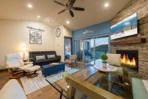 a living room with a couch and a fireplace at Minutes to Deer Valley and Park City, Private Hot Tub, Mountain Views, Living + Family, More in Heber City