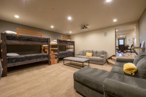 a living room with two bunk beds and a couch at Minutes to Deer Valley and Park City, Private Hot Tub, Mountain Views, Living + Family, More in Heber City