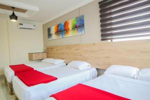Postel nebo postele na pokoji v ubytování Hotel Murali - Cerca del Aeropuerto de Guayaquil