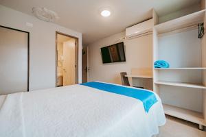 Postel nebo postele na pokoji v ubytování HOTEL VERANO