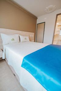 Postel nebo postele na pokoji v ubytování HOTEL VERANO