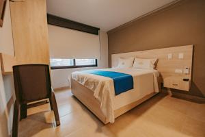 Postel nebo postele na pokoji v ubytování HOTEL VERANO