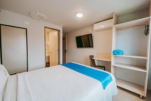 Postel nebo postele na pokoji v ubytování HOTEL VERANO