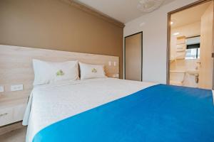 Postel nebo postele na pokoji v ubytování HOTEL VERANO