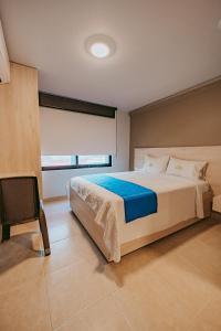 Postel nebo postele na pokoji v ubytování HOTEL VERANO