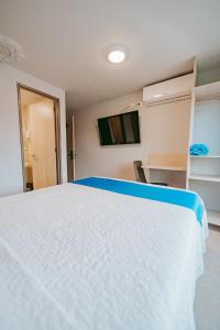 Postel nebo postele na pokoji v ubytování HOTEL VERANO