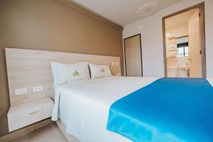 Postel nebo postele na pokoji v ubytování HOTEL VERANO