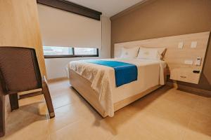 Postel nebo postele na pokoji v ubytování HOTEL VERANO