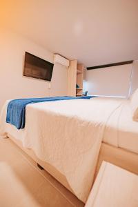 Postel nebo postele na pokoji v ubytování HOTEL VERANO