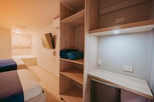 Postel nebo postele na pokoji v ubytování HOTEL VERANO