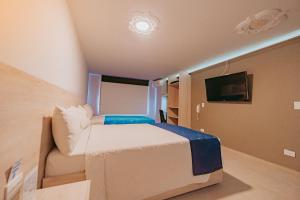 Postel nebo postele na pokoji v ubytování HOTEL VERANO