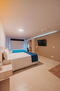 Postel nebo postele na pokoji v ubytování HOTEL VERANO