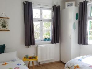 a bedroom with a bed and a window at to the lakeside promenade in Überlingen