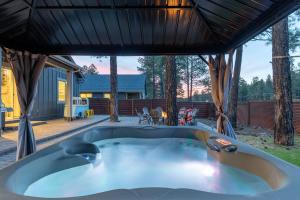 a hot tub in the backyard of a house at Flagstaff Route 66 Retreat in Flagstaff