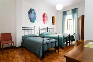 Postel nebo postele na pokoji v ubytování B&B Al Centro