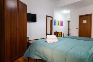 Postel nebo postele na pokoji v ubytování B&B Al Centro