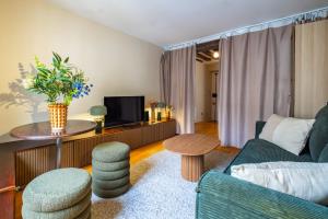 Μια τηλεόραση ή/και κέντρο ψυχαγωγίας στο Apt Central Hotel de Ville