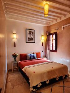 Postel nebo postele na pokoji v ubytování Riad Mumtaz Marrakech