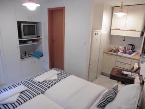 Postel nebo postele na pokoji v ubytování Room Leon