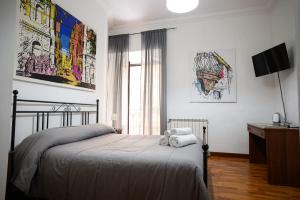 Postel nebo postele na pokoji v ubytování B&B Al Centro