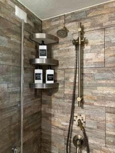 a shower in a bathroom with a tile wall at Gassa d'Amante in Montaretto +71 photos
