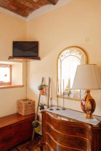 TV a/nebo společenská místnost v ubytování Il ricordo del chianti