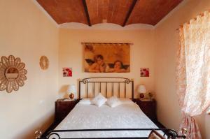 Postel nebo postele na pokoji v ubytování Il ricordo del chianti