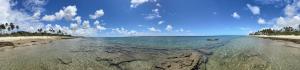 a view of a beach with a boat in the water at Apartamento a 400 metros da Praia do Frances-AL in Marechal Deodoro