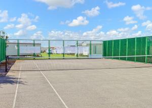 a tennis court with a net on a tennis court at Lido Beach in Prestatyn
