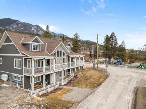 a house on the side of a street at Radiant Retreat -Spacious Home - Heart of Radium! in Radium Hot Springs