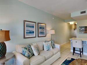 a living room with a couch and a table at Cassine Station 305 - Sea Ya in Santa Rosa Beach