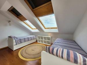 Postel nebo postele na pokoji v ubytování FGDR10E31C La Ría Dúplex Playa con vistas