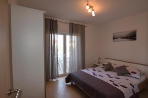 Posteľ alebo postele v izbe v ubytovaní Apartments Batarilo